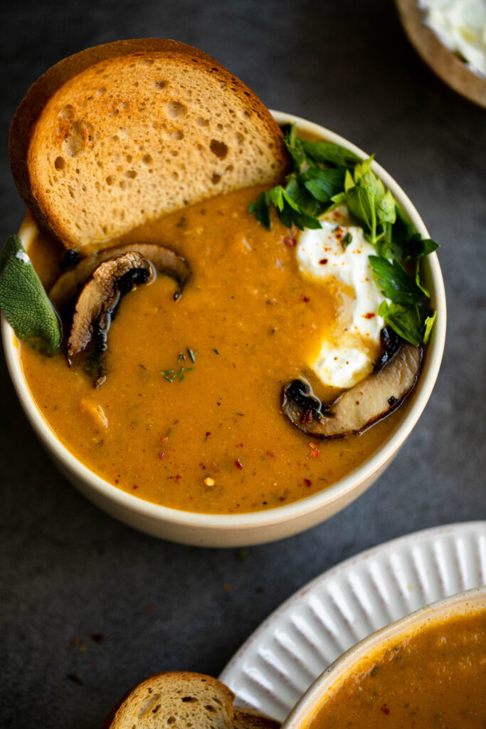 Top this creamy soup with mushrooms, dairy-free yogurt, herbs and toast for the perfect meal!