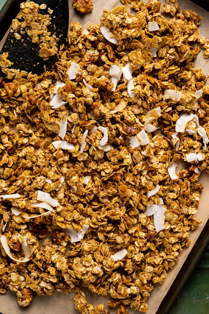 This granola recipes features coconut shreds, raw pecans, and a number of spices!