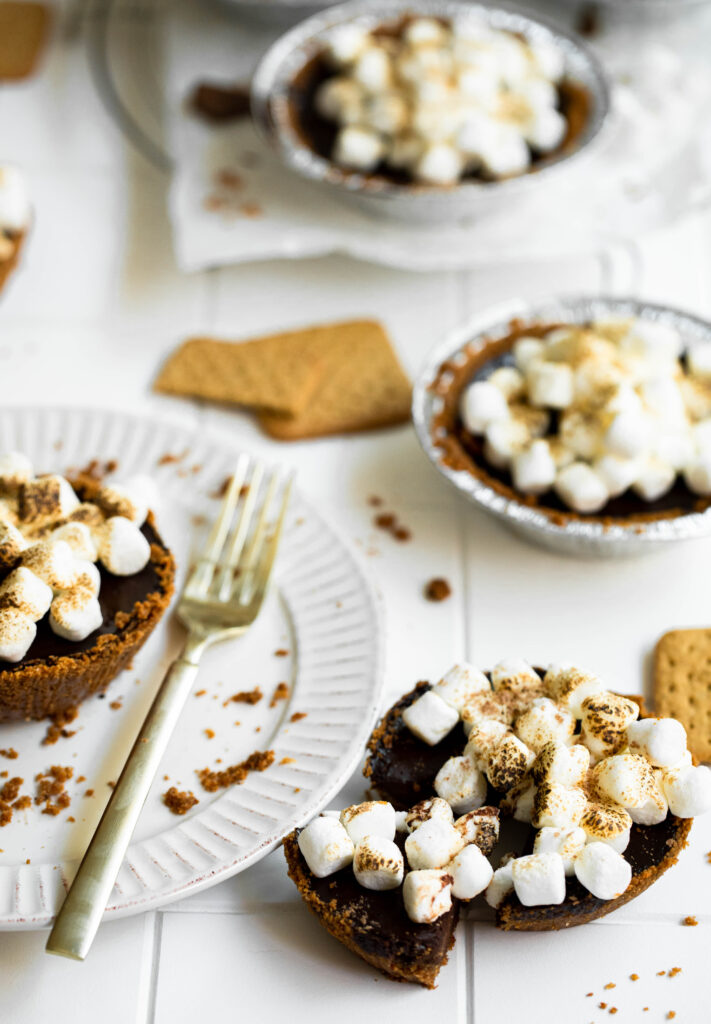 With a gluten-free graham cracker crust, these individual pies are made with a chocolate filling and topped with mini marshmallows.
