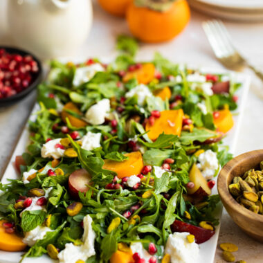 Persimmon salad with plums, burrata, mint, and pistachios!