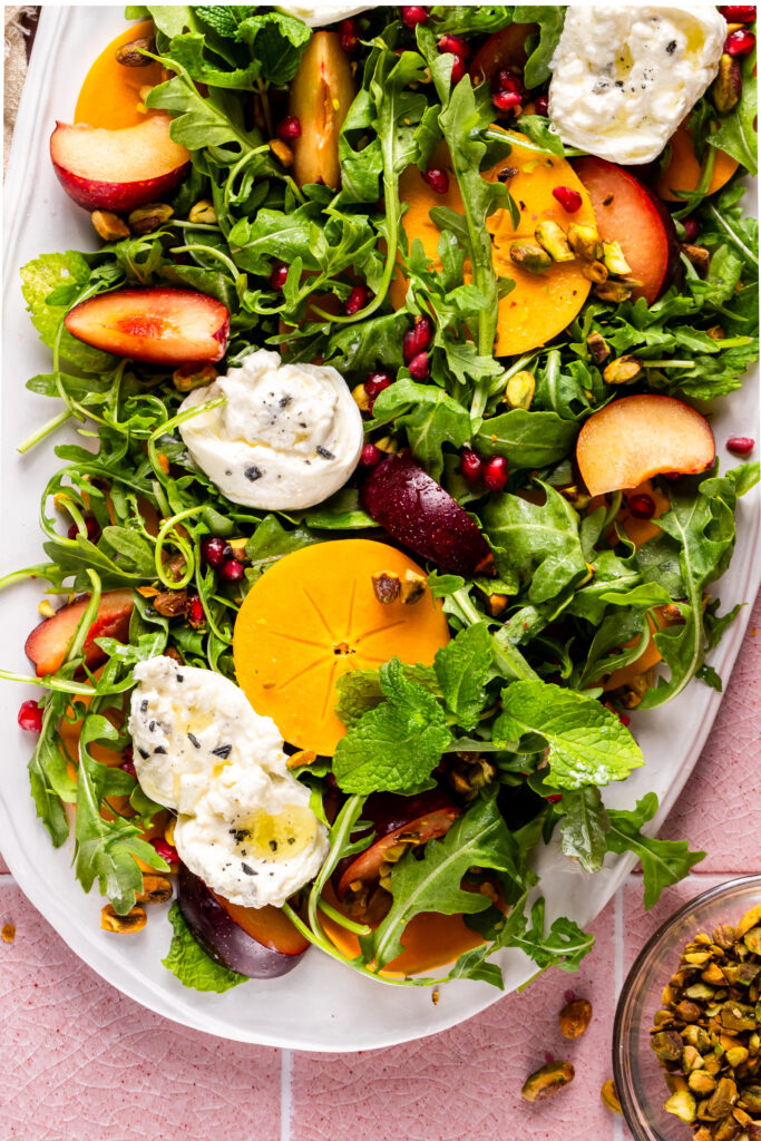 A close up of the persimmon salad showing detail of all the ingredients.