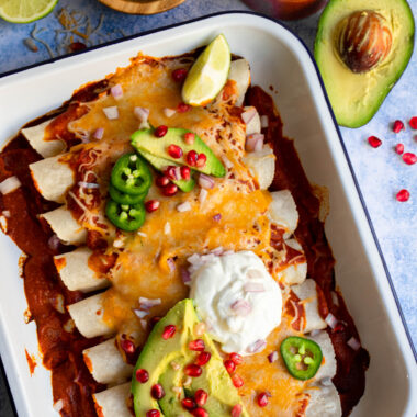 These gluten-free and vegetarian enchiladas with a rich homemade red enchilada sauce are the perfect recipe to make for Meatless Monday, or the next time you're craving Mexican food.
