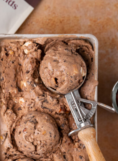 There are few things better than that perfect scoop of ice cream. This Rocky Road Ice Cream recipe with cocoa almonds, mini marshmallows, and LOTS of dark chocolate is a must make dessert for the warm summer months ahead.