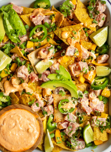 If you're looking for the perfect summer appetizer, this Spicy Ahi Tuna Nacho recipe is for you! Loaded with fresh tuna, sliced jalapeños, avocados, mangos, and cilantro- it really doesn't get fresher than this.