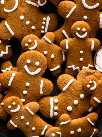a close up of the gingerbread men cookies fully iced and ready for serving.